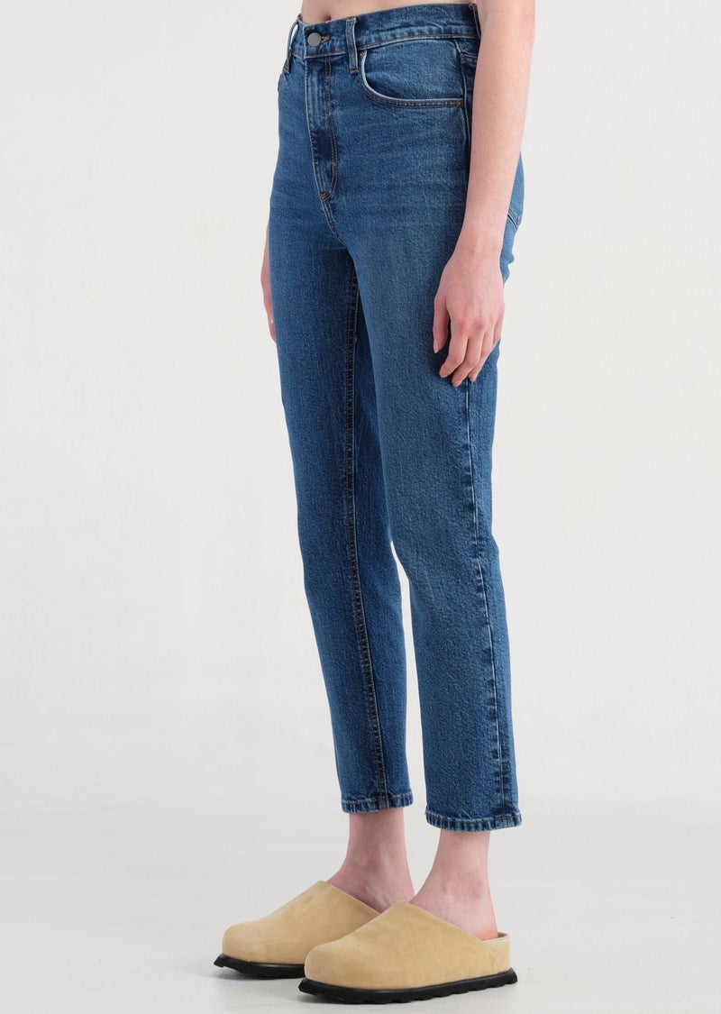woman wearing blue slim fit ankle jeans