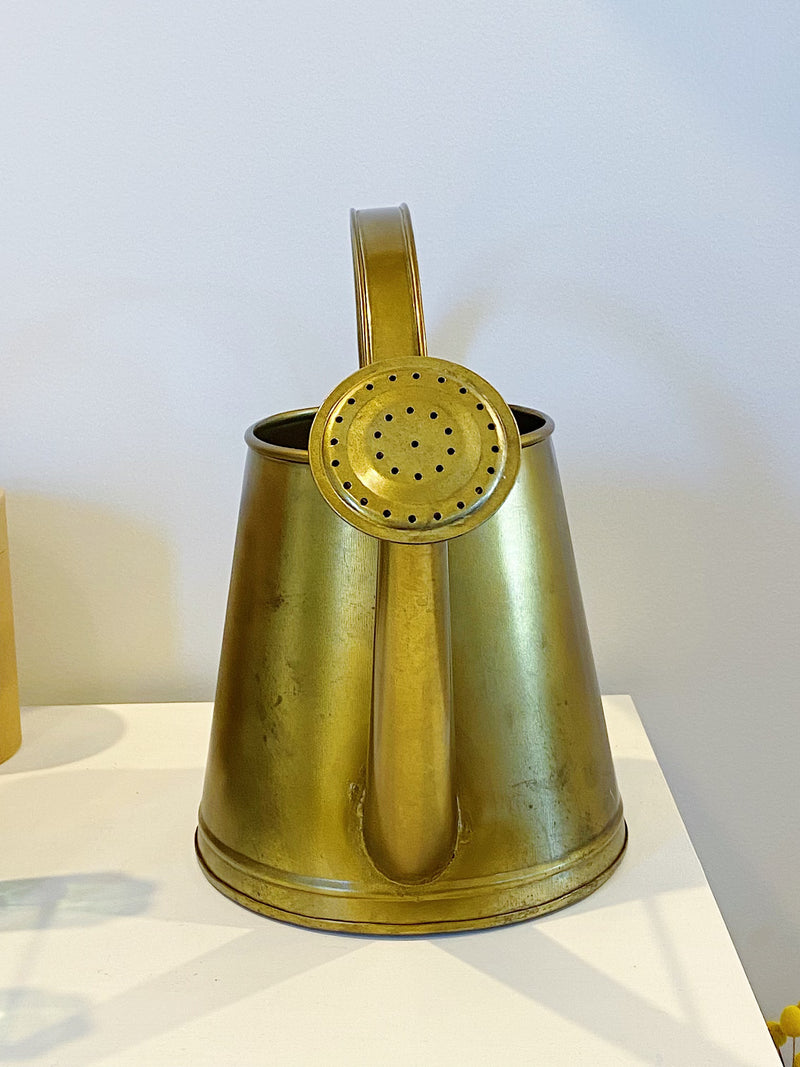 large gold watering can