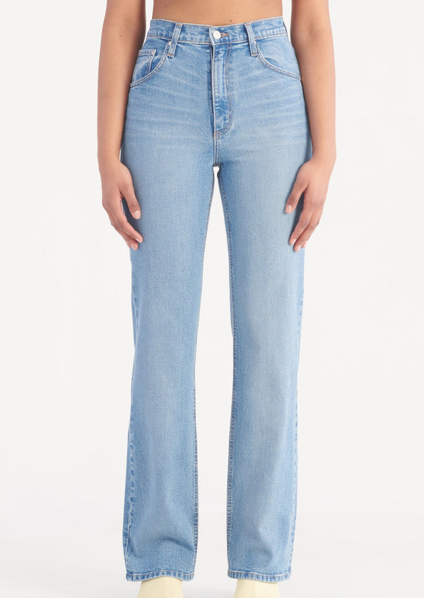 blue wash high rise jeans on woman